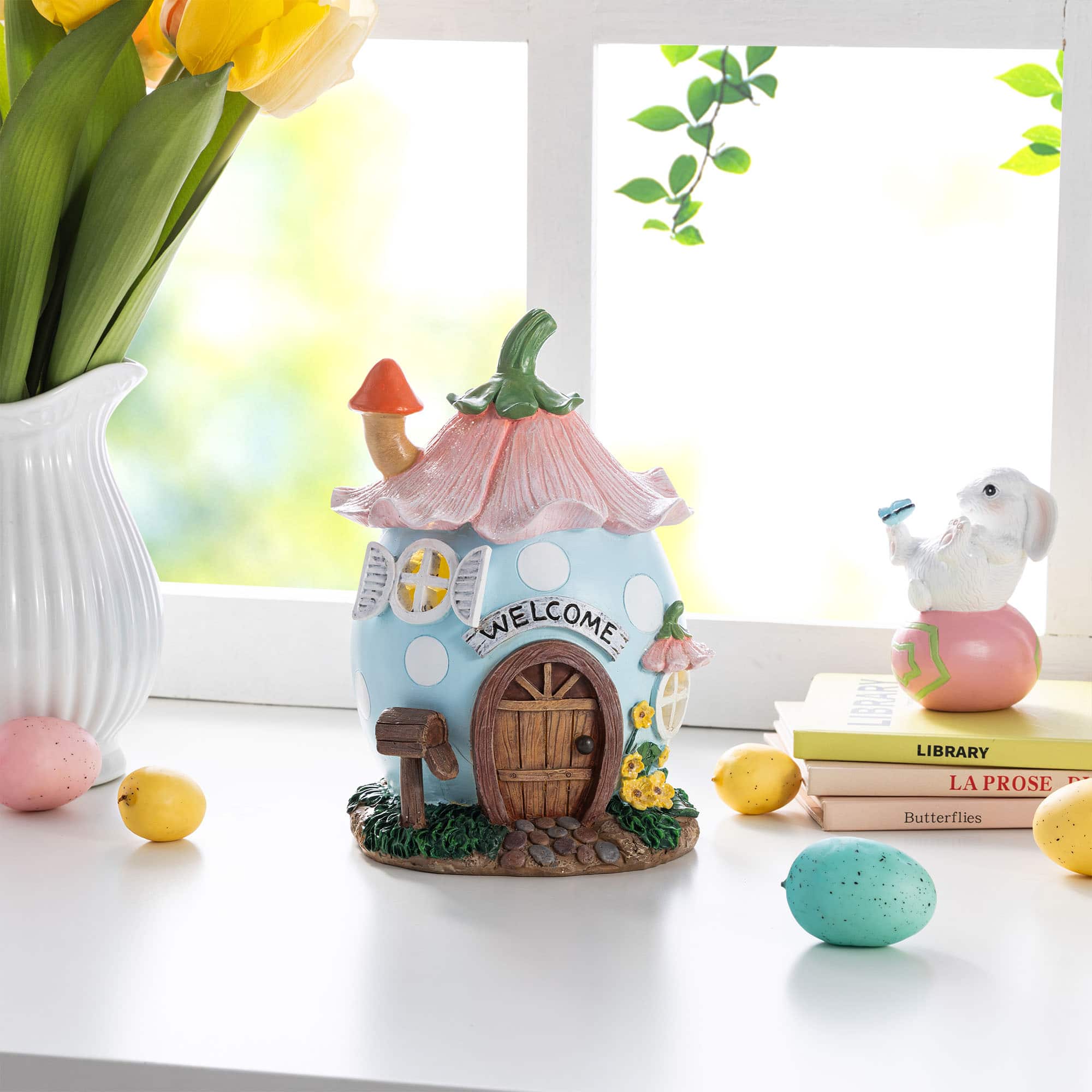 Glitzhome® 8" Lighted Easter Resin Egg-Shaped House Table Decor